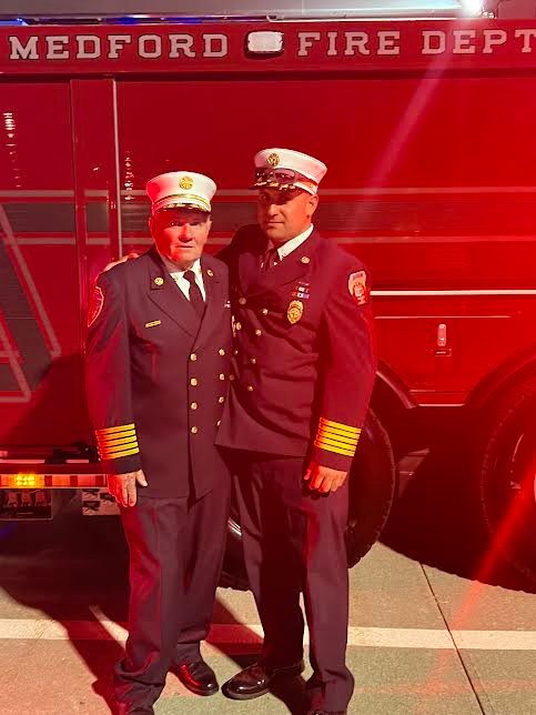 Medford Fire Department chief Michael Barry and Yaphank Fire Department chief Alex Zeruto (right), who said, “The truck is beautiful. Medford did a great job with the 100th anniversary.”